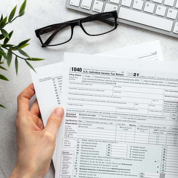 Accountant,Culculate,Taxes,-,Us,Tax,Form,On,Office,Table